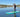female paddleboarder on Sandbanks Style paddleboard dressed for winter paddling