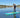 female paddleboarder on Sandbanks Style paddleboard dressed for winter paddling