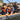 Family paddling a drop stitch kayak on a calm river.